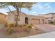 Appealing house featuring a three-car garage, desert landscaping, and a charming aesthetic at 1273 Olivia Parkway Pkwy, Henderson, NV 89011