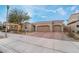 Inviting single-story home with a three-car garage and desert-friendly landscaping at 1273 Olivia Parkway Pkwy, Henderson, NV 89011