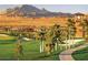 Community with golf course views, and palm trees along sidewalks and mountain views at 1273 Olivia Parkway Pkwy, Henderson, NV 89011