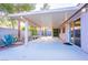 Spacious covered back patio with desert landscaping, offering a shaded spot for relaxation and entertainment at 1309 Misty View Ct, North Las Vegas, NV 89031