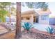 Charming covered back patio featuring desert landscaping and a concrete pad, perfect for outdoor living at 1309 Misty View Ct, North Las Vegas, NV 89031