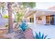Landscaped backyard featuring a covered patio, desert landscaping and privacy at 1309 Misty View Ct, North Las Vegas, NV 89031