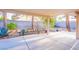 Backyard featuring a covered patio, desert landscaping and privacy wall at 1309 Misty View Ct, North Las Vegas, NV 89031