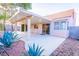 Backyard with a covered patio, desert landscaping and privacy wall at 1309 Misty View Ct, North Las Vegas, NV 89031
