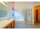 Bathroom featuring double sinks, a bathtub, and a glass-enclosed shower at 1309 Misty View Ct, North Las Vegas, NV 89031