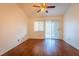 Bedroom featuring laminate floors, a sliding glass door, and a ceiling fan for comfortable living at 1309 Misty View Ct, North Las Vegas, NV 89031