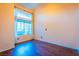 Bright bedroom with wood floors and a large window at 1309 Misty View Ct, North Las Vegas, NV 89031