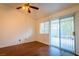 Bedroom with wood floors and a sliding glass door leading to the backyard at 1309 Misty View Ct, North Las Vegas, NV 89031