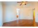 Bright bedroom features wood floors, a ceiling fan, and an ensuite bathroom at 1309 Misty View Ct, North Las Vegas, NV 89031