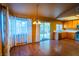 Dining area with hardwood floors, chandelier, and sliding glass door to backyard at 1309 Misty View Ct, North Las Vegas, NV 89031