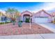 Charming single-story home featuring desert landscaping and a two-car garage at 1309 Misty View Ct, North Las Vegas, NV 89031
