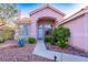 Inviting home entrance with desert landscaping, walkway, and decorative plants at 1309 Misty View Ct, North Las Vegas, NV 89031