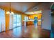 Open-concept dining area flows into kitchen with wood cabinets and stainless steel appliances at 1309 Misty View Ct, North Las Vegas, NV 89031