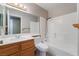 Bathroom featuring a single vanity, toilet, and shower-tub combo, with ample lighting at 1335 Heather Oaks Way, North Las Vegas, NV 89031