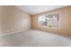 Neutral bedroom featuring carpet and large window at 1335 Heather Oaks Way, North Las Vegas, NV 89031