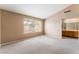 Bright bedroom featuring a large window and an ensuite bathroom entrance for added convenience at 1335 Heather Oaks Way, North Las Vegas, NV 89031