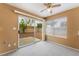 Living room features natural light, carpet and backyard access at 1335 Heather Oaks Way, North Las Vegas, NV 89031