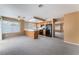 Open-concept living area with a kitchen and ample natural light at 1335 Heather Oaks Way, North Las Vegas, NV 89031