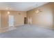 Spacious living room featuring neutral paint, plush carpet flooring, and a ceiling fan at 1335 Heather Oaks Way, North Las Vegas, NV 89031