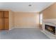 Cozy living room with plush carpeting, neutral walls, and a lit fireplace at 1335 Heather Oaks Way, North Las Vegas, NV 89031