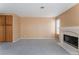 Cozy living room with plush carpeting, neutral walls, and a fireplace at 1335 Heather Oaks Way, North Las Vegas, NV 89031