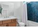 Well-lit bathroom with modern fixtures and a shower featuring stylish blue tiling at 144 Tre Pietre St, Henderson, NV 89011