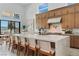 Bright kitchen featuring an island with seating, custom cabinets, and clerestory windows for abundant light at 144 Tre Pietre St, Henderson, NV 89011