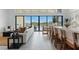 Open-concept living room showcasing stylish furnishings and expansive windows overlooking a pool and desert landscape at 144 Tre Pietre St, Henderson, NV 89011