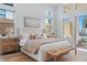 Bright bedroom with ample natural light, stylish furnishings, and direct access to the outdoor space for a private retreat at 144 Tre Pietre St, Henderson, NV 89011