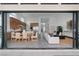 Seamless transition from indoor living to the outdoor with the large open door, featuring a spacious open floor plan at 144 Tre Pietre St, Henderson, NV 89011