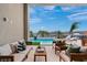Inviting outdoor patio with comfortable seating, a refreshing pool, and stunning views for relaxation and entertaining at 144 Tre Pietre St, Henderson, NV 89011