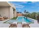 Stunning swimming pool and lounge area with modern design, clear water, and comfortable chairs for enjoying the sun at 144 Tre Pietre St, Henderson, NV 89011