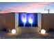 Mesmerizing water feature with sleek design, ambient lighting, and decorative stones creating a calming outdoor space at 144 Tre Pietre St, Henderson, NV 89011