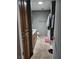 A neutral bathroom featuring tile floors, wood cabinets, and a shower with tile surround at 1812 Ivanhoe Way, Las Vegas, NV 89102