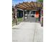 Extended driveway and covered area with shade, suitable for parking or outdoor activities at 1812 Ivanhoe Way, Las Vegas, NV 89102
