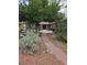 Charming home with lush greenery and a welcoming pathway to the entrance at 1812 Ivanhoe Way, Las Vegas, NV 89102
