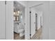 Bathroom featuring framed mirrors, decorative lighting, and tile floors at 2204 Monterey Ave, Las Vegas, NV 89104