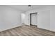 Bright bedroom featuring wood-look floors, closet, and white walls at 2204 Monterey Ave, Las Vegas, NV 89104