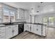 Clean kitchen with white cabinets, granite counters, and an island cooktop at 2204 Monterey Ave, Las Vegas, NV 89104