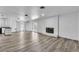 Open-concept living room featuring a decorative fireplace and laminate flooring at 2204 Monterey Ave, Las Vegas, NV 89104