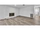 Spacious living room featuring laminate flooring and a cozy fireplace at 2204 Monterey Ave, Las Vegas, NV 89104