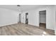 Spacious main bedroom with wood-look floors, ensuite bathroom, and a closet at 2204 Monterey Ave, Las Vegas, NV 89104