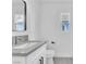 Bathroom with modern white vanity and gray countertop, updated faucet, mirror and toilet with modern fixtures at 244 N 19Th St, Las Vegas, NV 89101