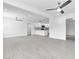 Spacious living room boasts new flooring, modern ceiling fans, recessed lighting and is open to the renovated kitchen at 244 N 19Th St, Las Vegas, NV 89101