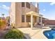 Backyard view featuring an inground pool, covered patio, and lush landscaping at 262 Cielito Lindo St, Henderson, NV 89012