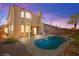 Back exterior view showcasing a private pool, covered patio, and desert landscaping at 262 Cielito Lindo St, Henderson, NV 89012