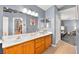 Bathroom featuring a double vanity, large mirror, and a view of other rooms at 262 Cielito Lindo St, Henderson, NV 89012