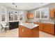 Bright kitchen featuring wooden cabinets, an island, and lots of natural light at 262 Cielito Lindo St, Henderson, NV 89012
