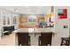 Spacious kitchen with stainless steel appliances, island, and a breakfast bar at 262 Cielito Lindo St, Henderson, NV 89012