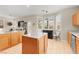 Open-concept kitchen with an island and views into the living room at 262 Cielito Lindo St, Henderson, NV 89012